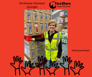 Image of Claire, one of our warehouse volunteers standing in front of a pallet of cereal and wearing hi vis vest