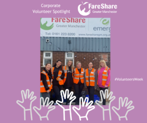 Group of corporate volunteers standing outside FareShare Greater Manchester HQ