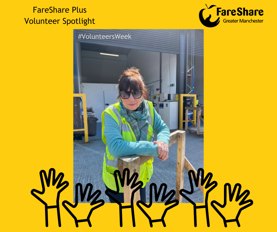 Sally, a FareShare Plus volunteering wearing high visibility vest & standing in the yard leaning on a trolley
