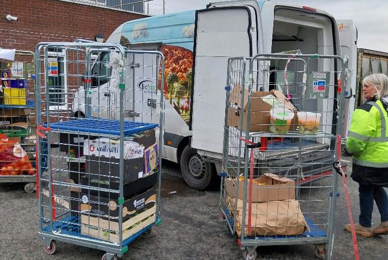 Bidfood van at FareShare with doors open and stock in trolleys