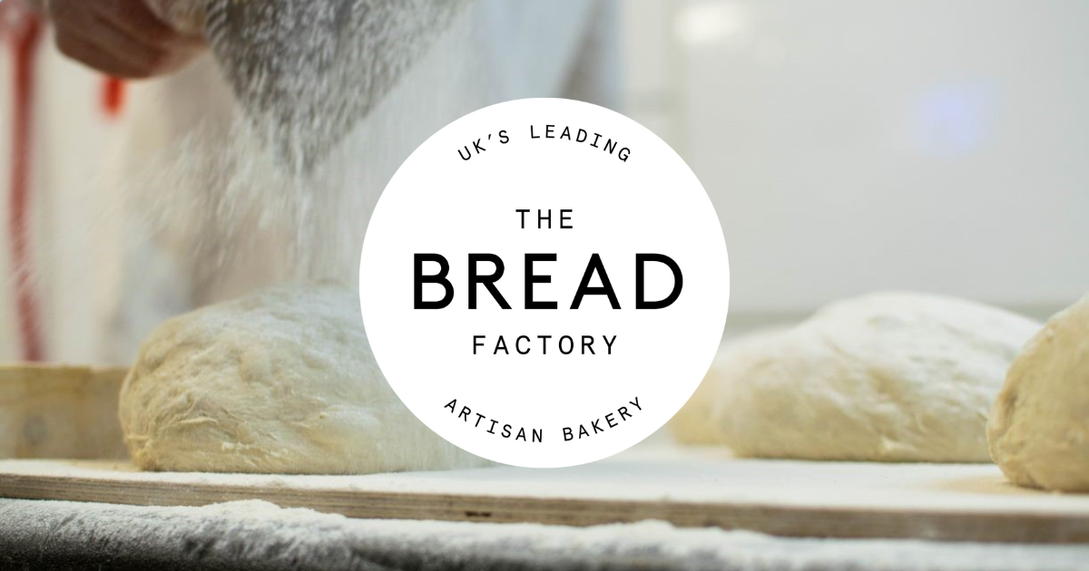 baker flouring dough with The Bread Factory logo