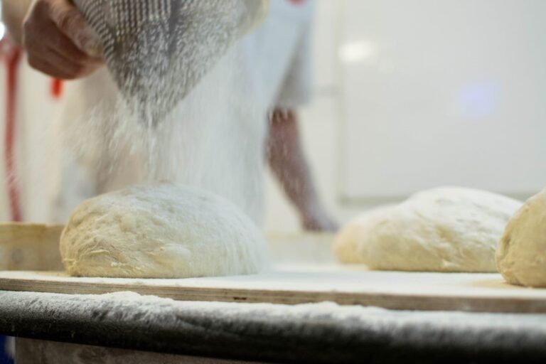 baker flouring dough