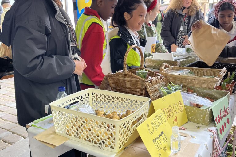 Young Marketeers - Abbott Community Primary School stall with adult helper