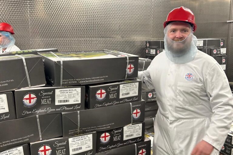 Hartshead Meats colleague standing in a walk-in fridge with Hartshead Meat boxes