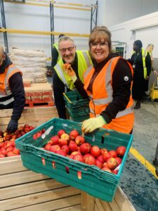 Image shows two N Brown Colleagues working in the FareShare Greater Manchester warehouse on a corporate volunteering day