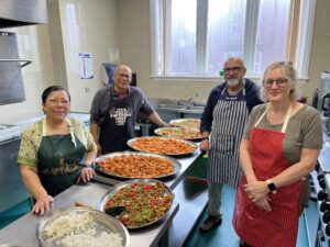 Tameside Meals Project team photo. Image shows the four volunteers from Tameside Meals Project, Kala, Mukul, Raj and Helen who were interviewed for the Food Stories Podcast episode