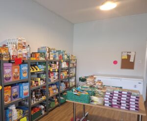 Internal photo of Dukinfield Pantry showing food on the shelves and table