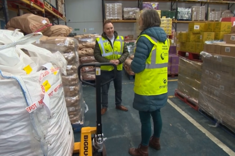 Image shows our Chief Executive Lucy Danger being interviewed by BBC North West Tonight reporter Phil Cunliffe in our warehouse