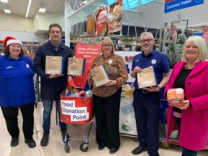 Image shows Tesco Food Collection group photo with volunteers and staff from Tesco in November 2024